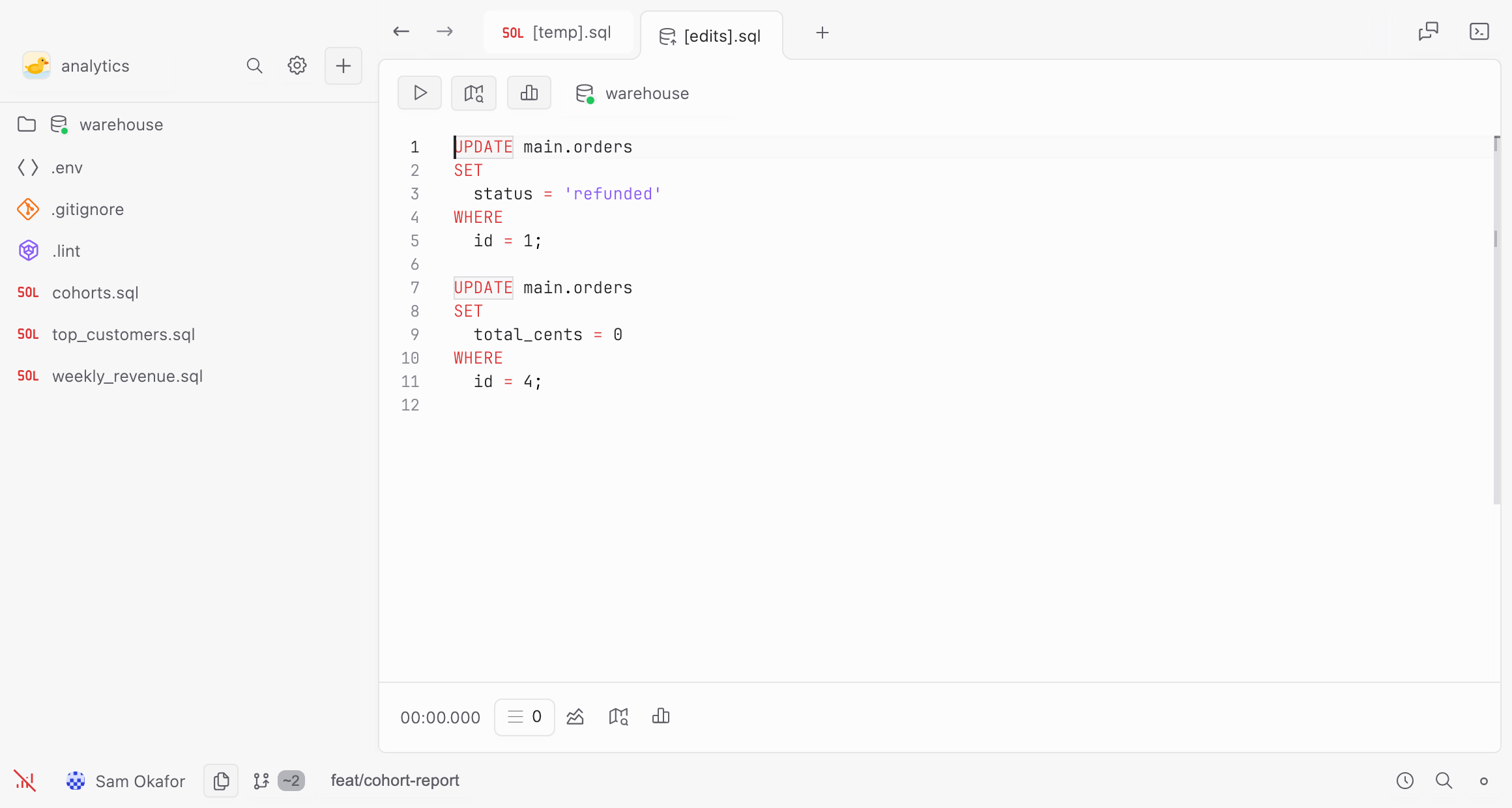 The generated file: two UPDATE statements against main.orders, one setting a quoted status and one an unquoted number, each with a WHERE on the row’s id.